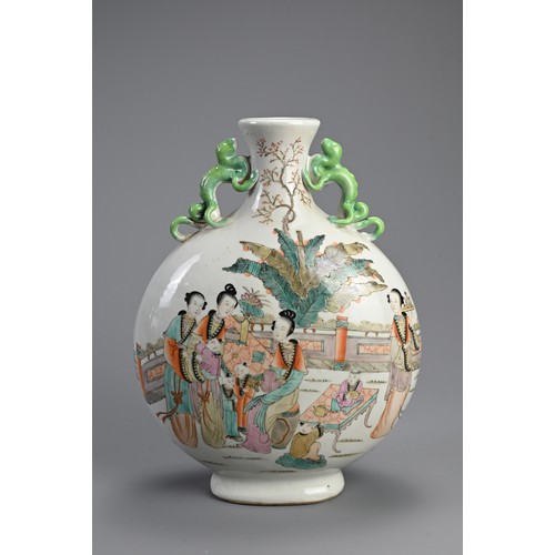 151 - A CHINESE FAMILLE ROSE PORCELAIN MOONFLASK. With green glazed chilong form handles, decorated with l... 