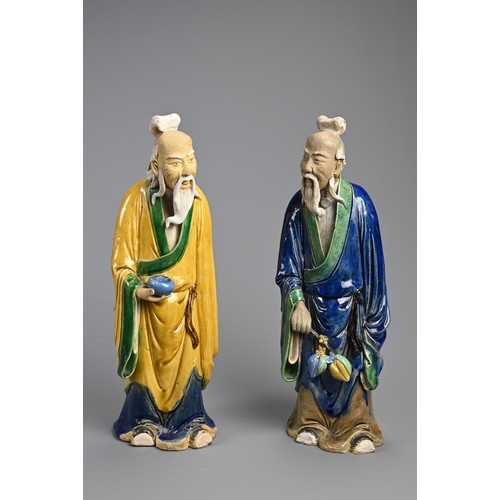 166 - A LARGE PAIR OF CHINESE SHIWAN POTTERY FIGURES, EARLY 20TH CENTURY. Sancai glazed standing figures d... 