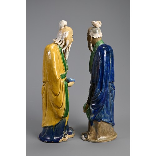 166 - A LARGE PAIR OF CHINESE SHIWAN POTTERY FIGURES, EARLY 20TH CENTURY. Sancai glazed standing figures d... 