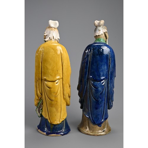 166 - A LARGE PAIR OF CHINESE SHIWAN POTTERY FIGURES, EARLY 20TH CENTURY. Sancai glazed standing figures d... 