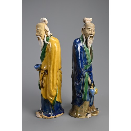 166 - A LARGE PAIR OF CHINESE SHIWAN POTTERY FIGURES, EARLY 20TH CENTURY. Sancai glazed standing figures d... 