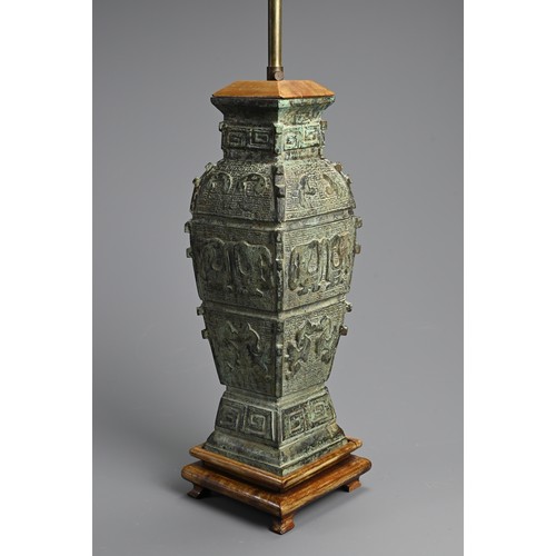 155 - A CHINESE ARCHAIC STYLE BRONZE LAMP, 20TH CENTURY. Mounted on wooden base with lamp fitting. Vase 36... 