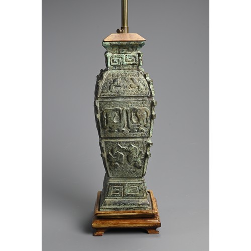 155 - A CHINESE ARCHAIC STYLE BRONZE LAMP, 20TH CENTURY. Mounted on wooden base with lamp fitting. Vase 36... 