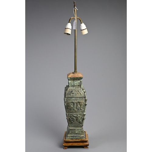 155 - A CHINESE ARCHAIC STYLE BRONZE LAMP, 20TH CENTURY. Mounted on wooden base with lamp fitting. Vase 36... 