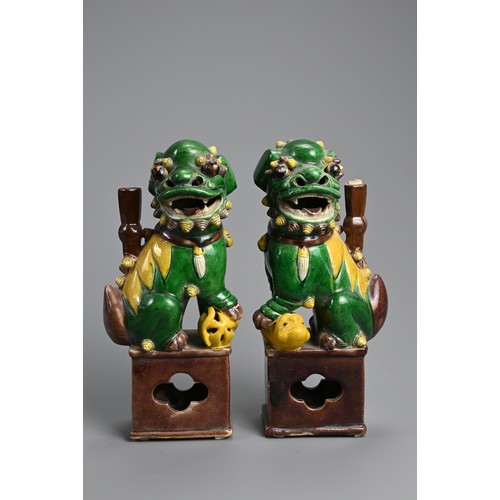 169 - A PAIR OF CHINESE SANCAI GLAZED PORCELAIN JOSS STICK HOLDERS, 19/20TH CENTURY. In the form of a foo ... 