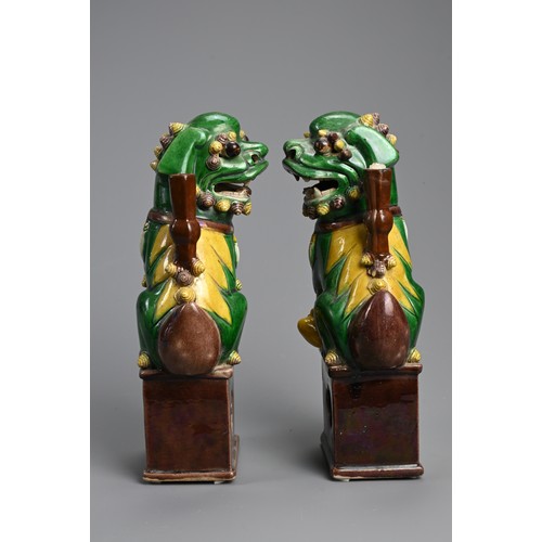 169 - A PAIR OF CHINESE SANCAI GLAZED PORCELAIN JOSS STICK HOLDERS, 19/20TH CENTURY. In the form of a foo ... 