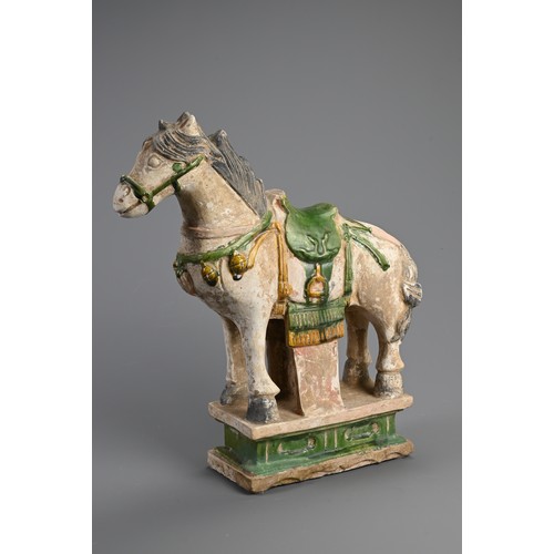 170 - A LARGE CHINESE SANCAI GLAZED POTTERY MODEL OF A HORSE, MING DYNASTY (1368-1644). Standing four squa... 