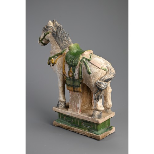 170 - A LARGE CHINESE SANCAI GLAZED POTTERY MODEL OF A HORSE, MING DYNASTY (1368-1644). Standing four squa... 