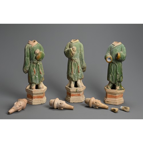 171 - THREE LARGE CHINESE SANCAI GLAZED POTTERY MODELS OF ATTENDANTS, MING DYNASTY (1368-1644). Standing d... 