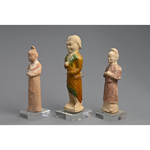 173 - A CHINESE SANCAI GLAZED POTTERY FIGURE WITH TWO OTHER PAINTED FIGURES OF ATTENDANTS, TANG DYNASTY (6... 