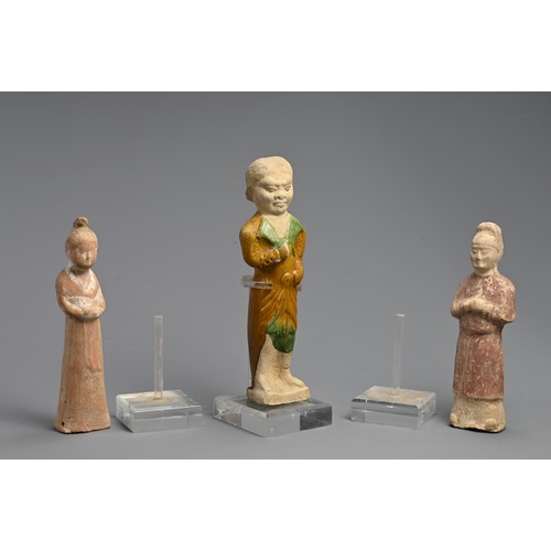 173 - A CHINESE SANCAI GLAZED POTTERY FIGURE WITH TWO OTHER PAINTED FIGURES OF ATTENDANTS, TANG DYNASTY (6... 