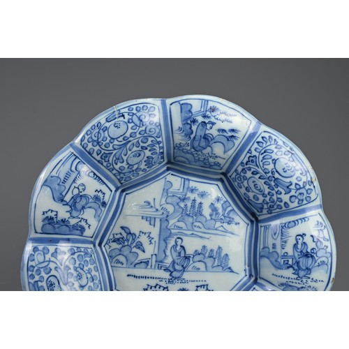 191 - A DELFT TIN GLAZED EARTHENWARE DISH, 17/18TH CENTURY. Of flared lobed form decorated in the Chinese ... 