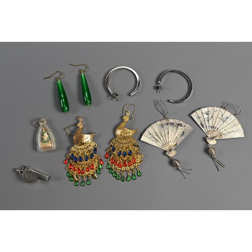 54 - A MIXED LOT OF COSTUME JEWELLERY, 20TH CENTURY. To include a pair of green glass earrings, peacock d... 