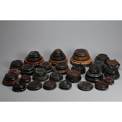 226 - A QUANTITY OF CHINESE WOOD DISPLAY STANDS, MAINLY 20TH CENTURY. All or circular form. Inner diameter... 