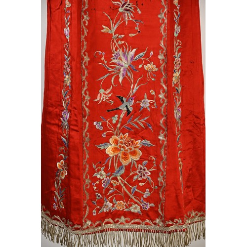 227 - TWO 20TH CENTURY CHINESE EMBROIDERED SILK SKIRTS AND A JACKET. The first skirt in black silk embroid... 