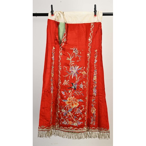 227 - TWO 20TH CENTURY CHINESE EMBROIDERED SILK SKIRTS AND A JACKET. The first skirt in black silk embroid... 