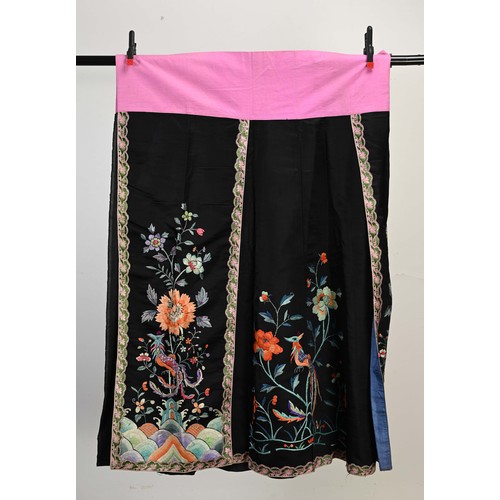 227 - TWO 20TH CENTURY CHINESE EMBROIDERED SILK SKIRTS AND A JACKET. The first skirt in black silk embroid... 