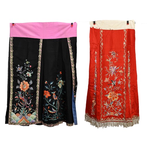 227 - TWO 20TH CENTURY CHINESE EMBROIDERED SILK SKIRTS AND A JACKET. The first skirt in black silk embroid... 