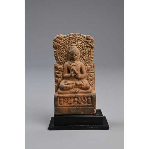 212 - AN INDIAN BHIMA TERRACOTTA TEMPLE STELE AND TWO OTHERS.  The first moulded with a seated Buddha befo... 