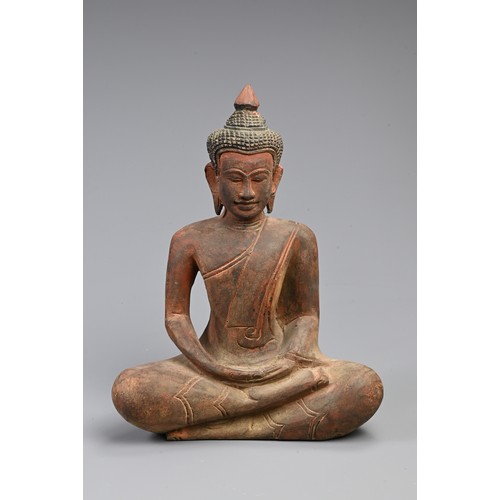 205 - A 20TH CENTURY THAI RED PAINTED WOODEN STATUE OF A BUDDHA. In bhumisparsha mudra, with hands cupped,... 