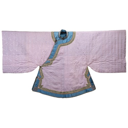 235 - EARLY 20TH CENTURY CHINESE LILAC SILK WINTER ROBE. With flared wide sleeves, edge in blue silk with ... 