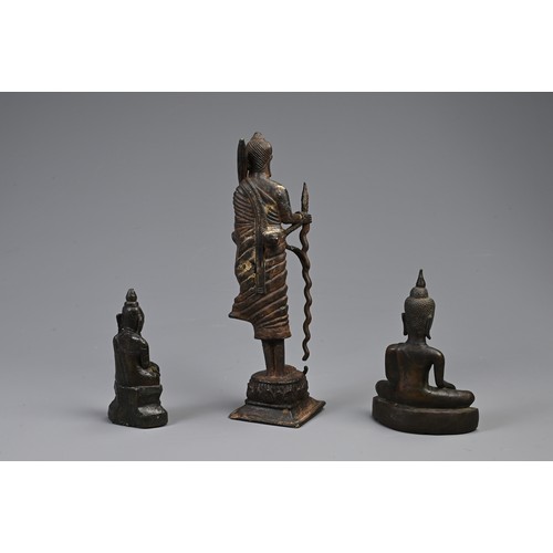 209 - THREE SOUTH EAST ASIAN BRONZE MODELS OF BUDDHAS. Comprising: a buddha Shakyamuni, Laos, seated in dh... 