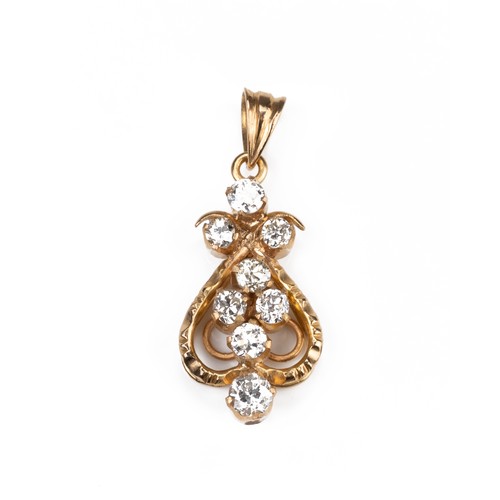 48 - A HIGH CARAT YELLOW GOLD DIAMOND PENDANT, MID 20TH CENTURY. Eight round cut diamonds in openwork mou... 