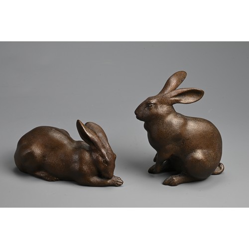 308 - A PAIR OF JAPANESE BRONZE OKIMONO OF HARES, USAGI, EARLY 20TH CENTURY. Naturalistically modelled in ... 