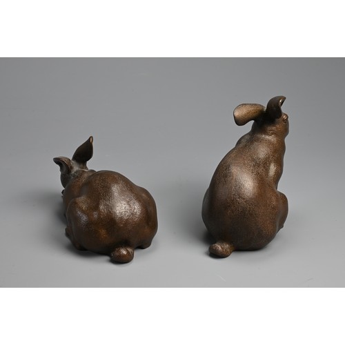 308 - A PAIR OF JAPANESE BRONZE OKIMONO OF HARES, USAGI, EARLY 20TH CENTURY. Naturalistically modelled in ... 