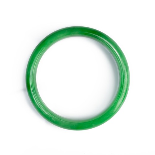 58 - A JADEITE CIRCULAR BANGLE. Of D shape. Total diameter 7cm, Inner diameter 5.7mm. Weight 41.7 grams