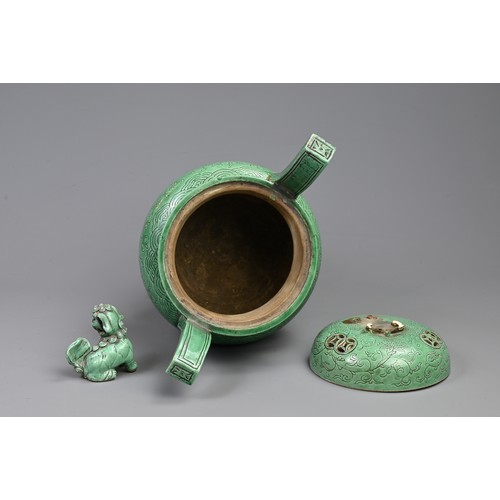 165 - A LARGE CHINESE GREEN GLAZED PORCELAIN TRIPOD CENSER AND COVER, 19/20TH CENTURY. Raised on three myt... 