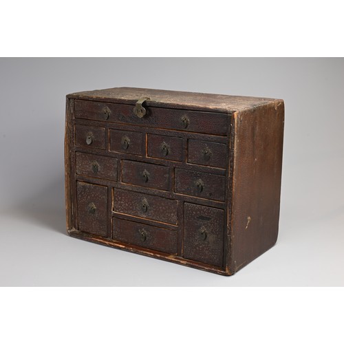 328 - A CHINESE LACQUERED APOTHECARY CABINET, 19TH CENTURY. Of rectangular form with twelve drawers and me... 