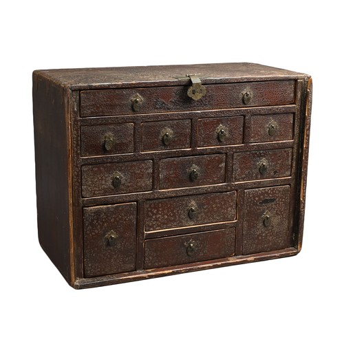 328 - A CHINESE LACQUERED APOTHECARY CABINET, 19TH CENTURY. Of rectangular form with twelve drawers and me... 