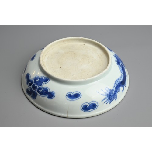 59 - A CHINESE BLUE AND WHITE PORCELAIN DISH, 18TH CENTURY. With rounded sides and rolled rim decorated w... 