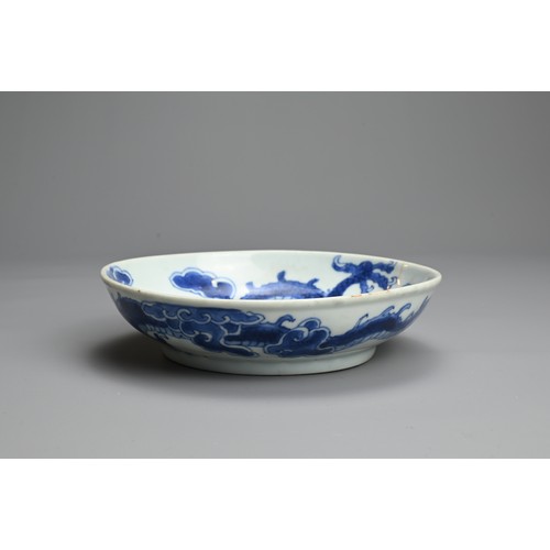 59 - A CHINESE BLUE AND WHITE PORCELAIN DISH, 18TH CENTURY. With rounded sides and rolled rim decorated w... 