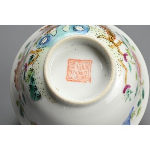 63 - A CHINESE FAMILLE ROSE PORCELAIN BOWL, TONGZHI PERIOD. Decorated with two phoenix perched on rockwor... 