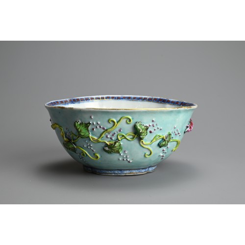 65 - A CHINESE TURQUOISE GROUND FAMILLE ROSE QUATRE LOBED BOWL, 18/19TH CENTURY. The exterior decorated w... 