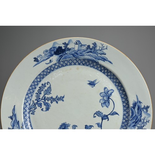 73 - A LARGE CHINESE BLUE AND WHITE PORCELAIN DISH, 18TH CENTURY. Decorated with floral sprays, a bird an... 