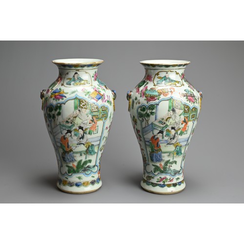 53 - A PAIR OF CHINESE FAMILLE ROSE PORCELAIN VASES, 19TH CENTURY. Of baluster form with lion ring mask r... 