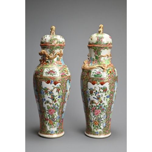 54 - A PAIR OF CHINESE CANTON FAMILLE ROSE PORCELAIN VASES AND COVERS, 19/20TH CENTURY. Of baluster form ... 