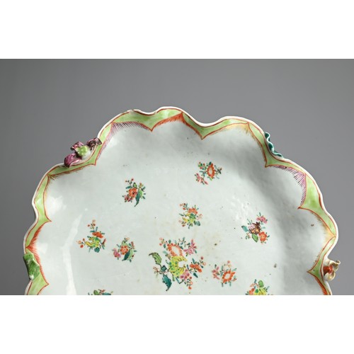 75 - A CHINESE FAMILLE ROSE PORCELAIN LOTUS DISH, 18TH CENTURY. Of lobed form in the form of a large lotu... 