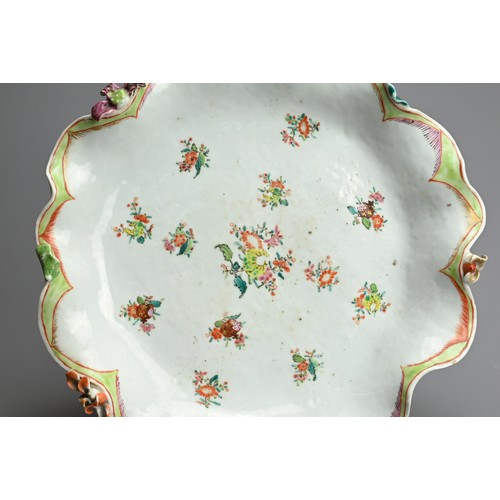 75 - A CHINESE FAMILLE ROSE PORCELAIN LOTUS DISH, 18TH CENTURY. Of lobed form in the form of a large lotu... 