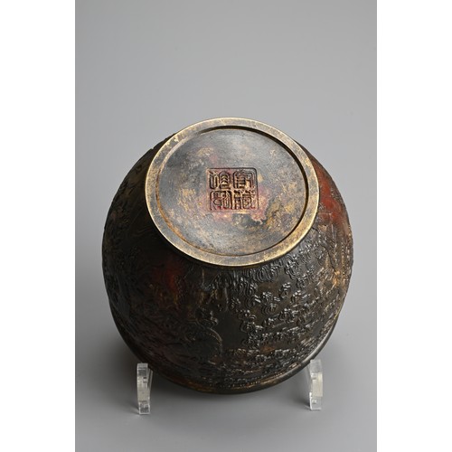 76 - A CHINESE PARCEL GILT AND RED LACQUERED JAR. Decorated to the exterior in relief with dragons chasin... 