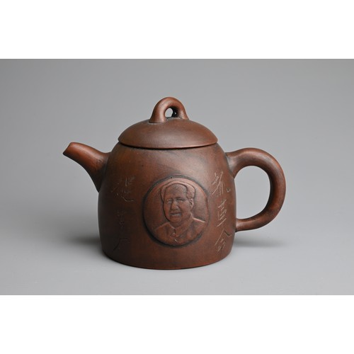 77 - A CHINESE YIXING ZISHA TEAPOT. Featuring portrait of Mao Zedong in relief with inscription. With imp... 