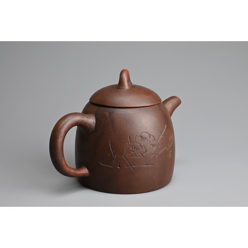 77 - A CHINESE YIXING ZISHA TEAPOT. Featuring portrait of Mao Zedong in relief with inscription. With imp... 