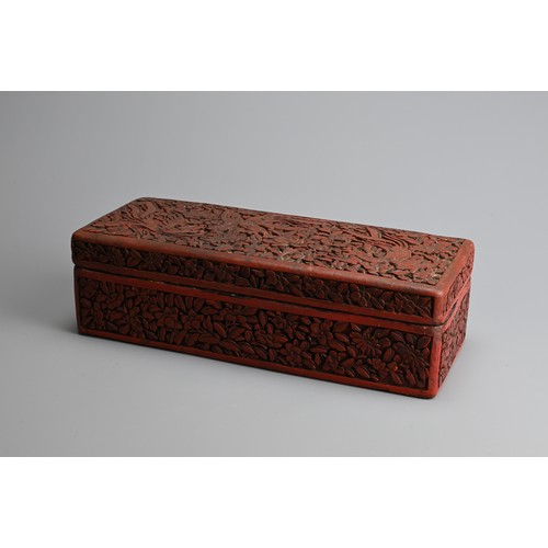 85 - A CHINESE RED LACQUER BOX AND COVER, EARLY 20TH CENTURY. Of rectangular form carved in relief with p... 