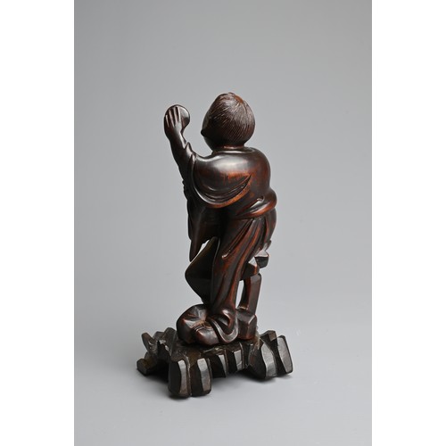 89 - A CHINESE BOXWOOD FIGURE OF LIU HAICHAN, 20TH CENTURY. The immortal standing dressed in robes with t... 