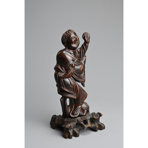 89 - A CHINESE BOXWOOD FIGURE OF LIU HAICHAN, 20TH CENTURY. The immortal standing dressed in robes with t... 