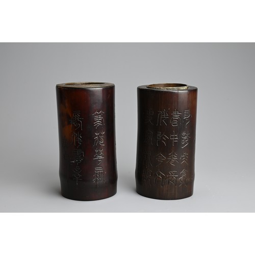 91 - TWO CHINESE METAL LINED BAMBOO BRUSH POTS, 20TH CENTURY. Each of cylindrical form carved with landsc... 