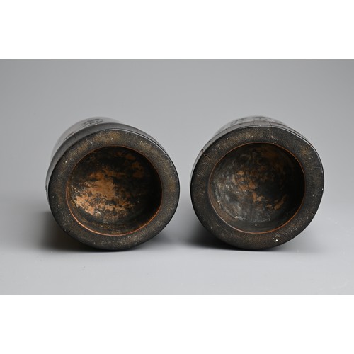 91 - TWO CHINESE METAL LINED BAMBOO BRUSH POTS, 20TH CENTURY. Each of cylindrical form carved with landsc... 